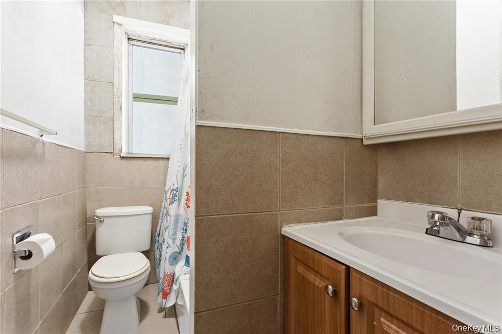 97-28 41st Avenue Queens, NY 11368 - Photo 21 of 29 a bathroom with a sink and a toilet