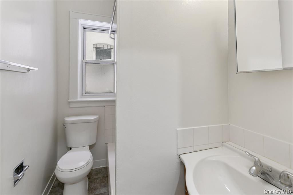 97-28 41st Avenue Queens, NY 11368 - Photo 5 of 29 a white toilet sitting next to a bathroom sink