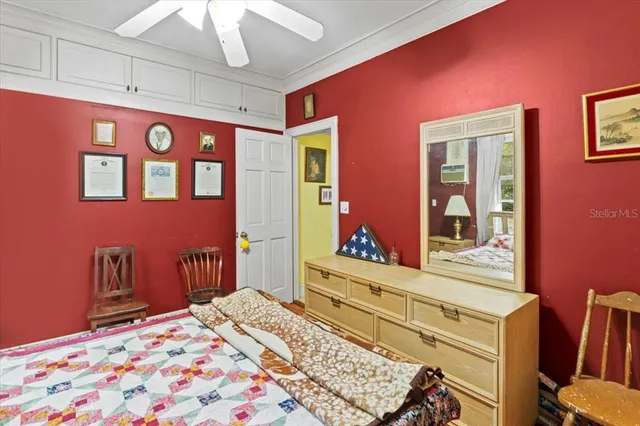 a bedroom with a bed and a dresser