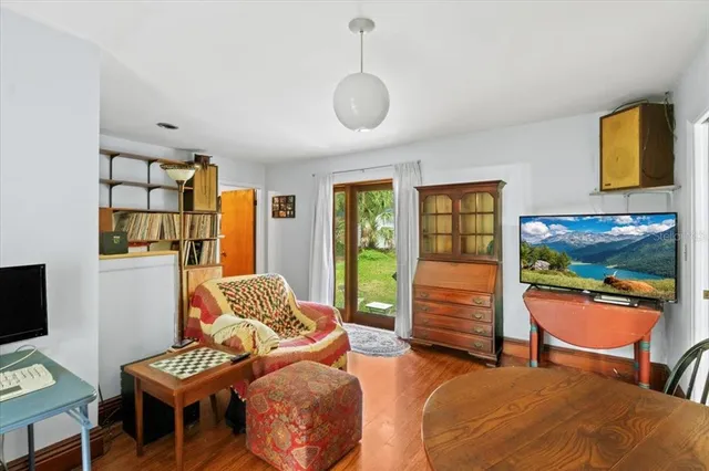 a bedroom with furniture and a flat screen tv
