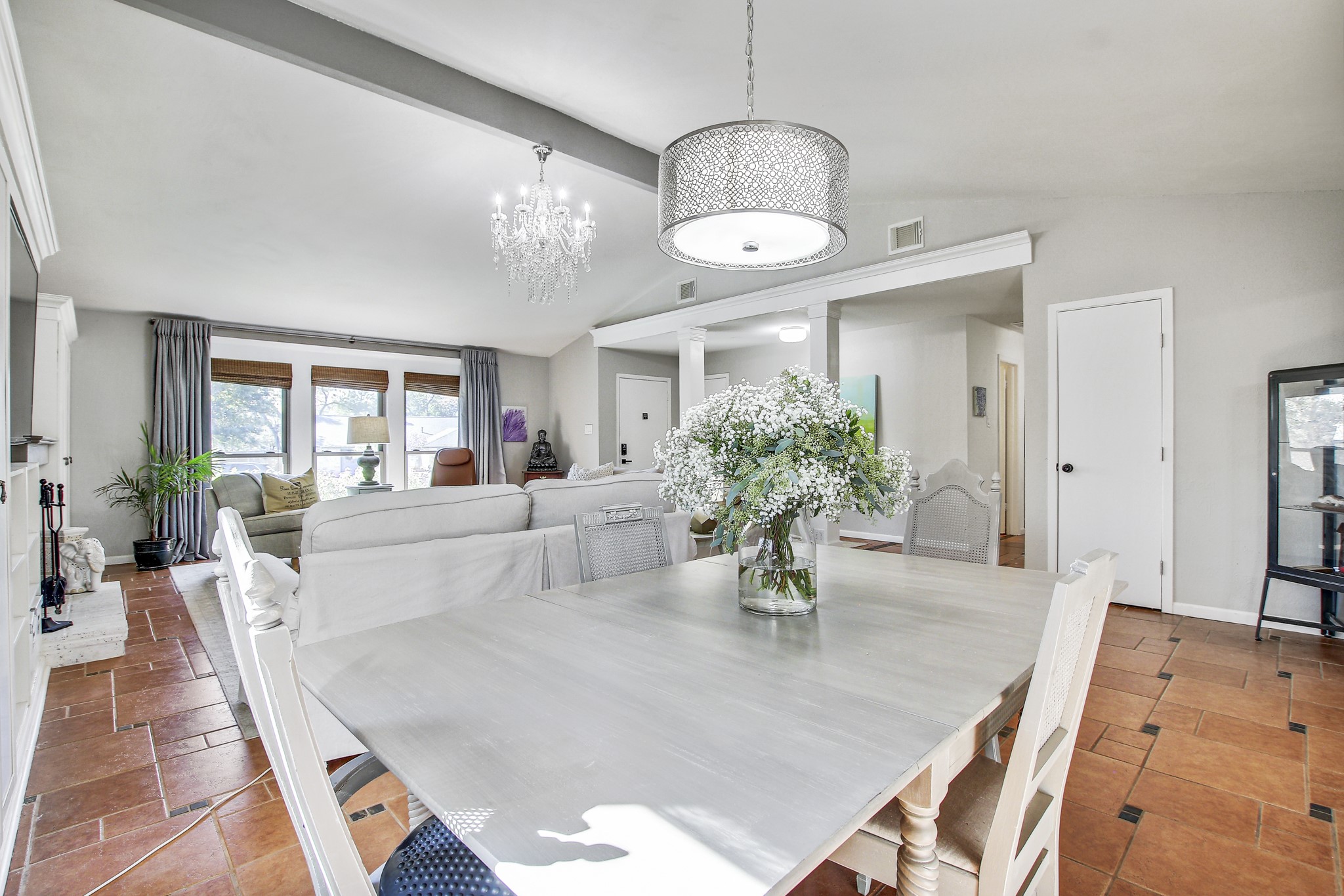 7741 Manassas Drive Austin, TX 78745 - Photo 11 of 39 Dining room featuring baseboards and a chandelier