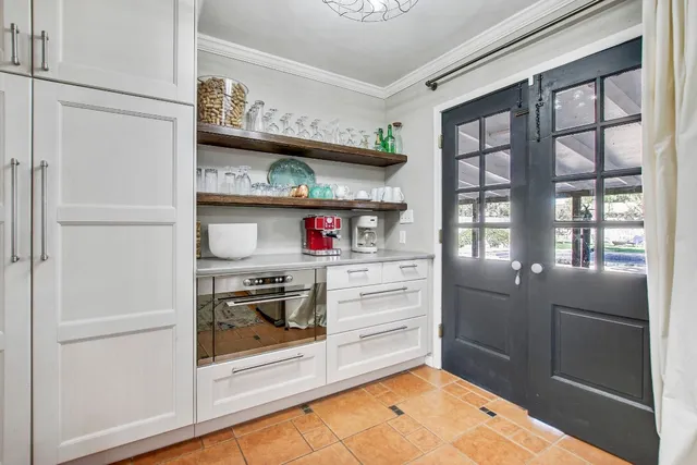 a room with furniture and a book shelf