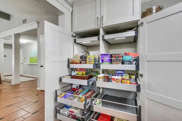 a kitchen with stainless steel appliances a refrigerator and cabinets