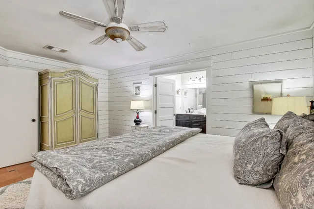 a white toilet sitting next to a bath tub