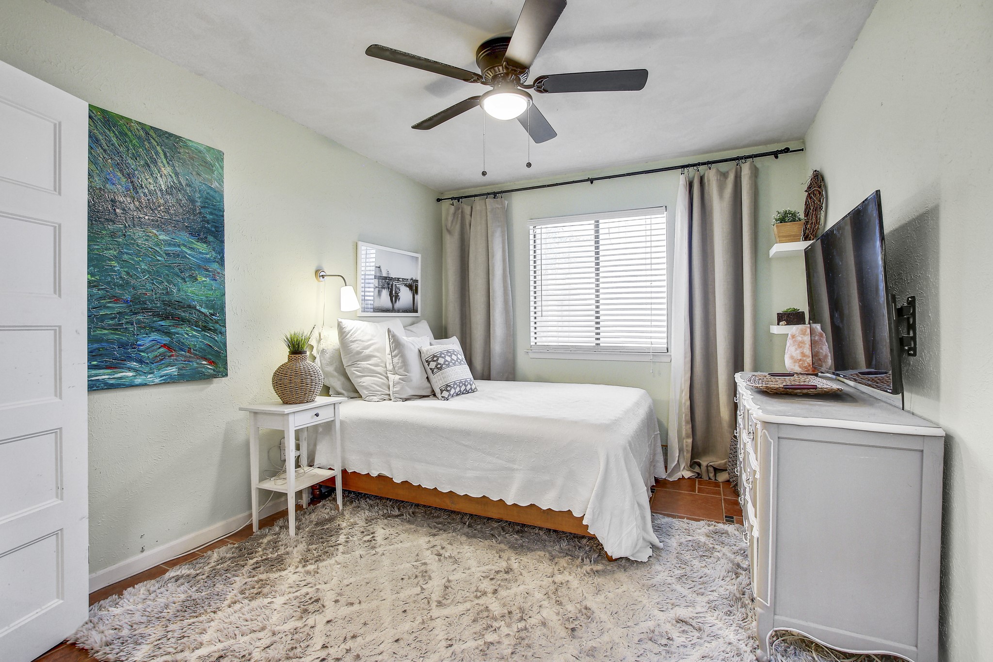 7741 Manassas Drive Austin, TX 78745 - Photo 23 of 39 Bedroom featuring ceiling fan and baseboards