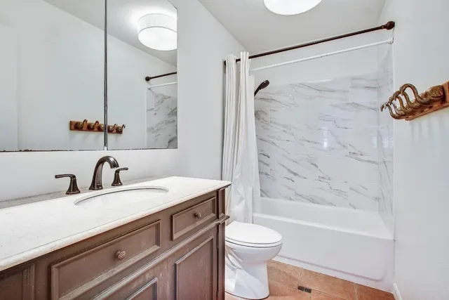 a view of a dining room with furniture large windows and wooden floor