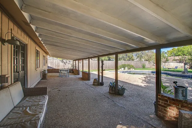 a front view of house with yard and outdoor seating