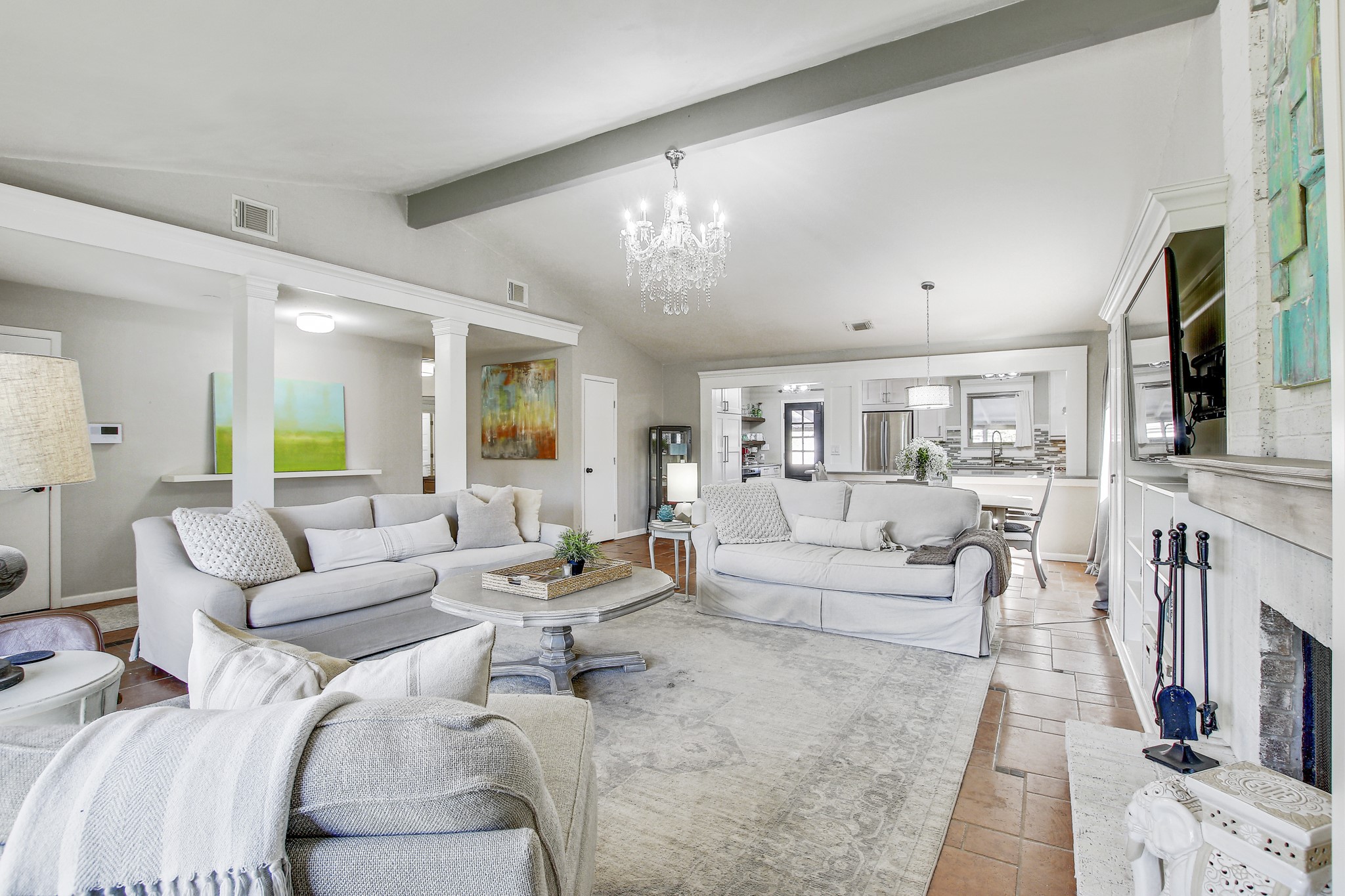 7741 Manassas Drive Austin, TX 78745 - Photo 7 of 39 Living area with a chandelier and a fireplace