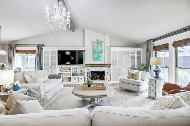 a dining room with furniture and a flat screen tv