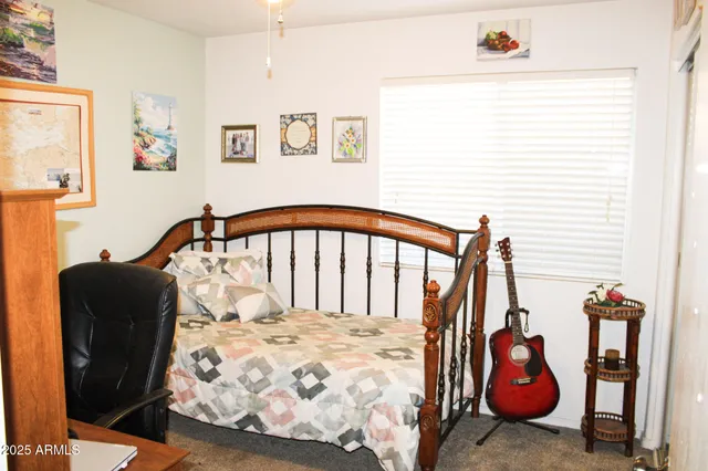 a bedroom with furniture and wooden floor