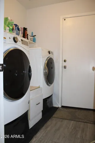 a utility room with dryer and washer