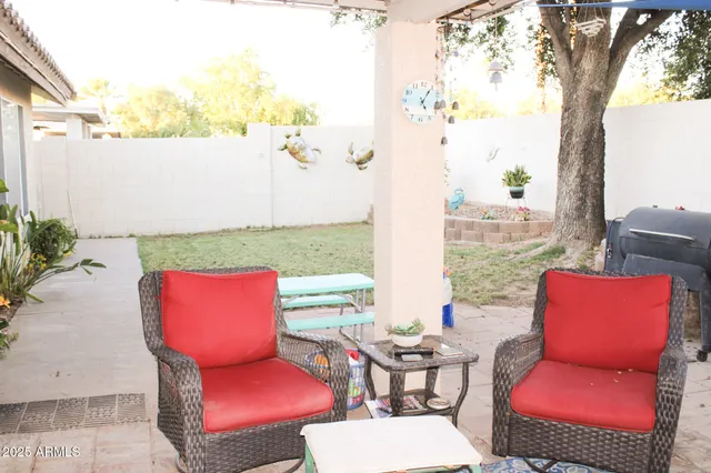 a room with patio chairs