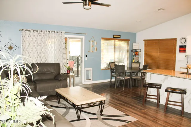 a living room with furniture and a window