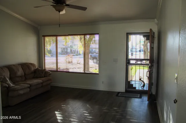 a living room with furniture and a window