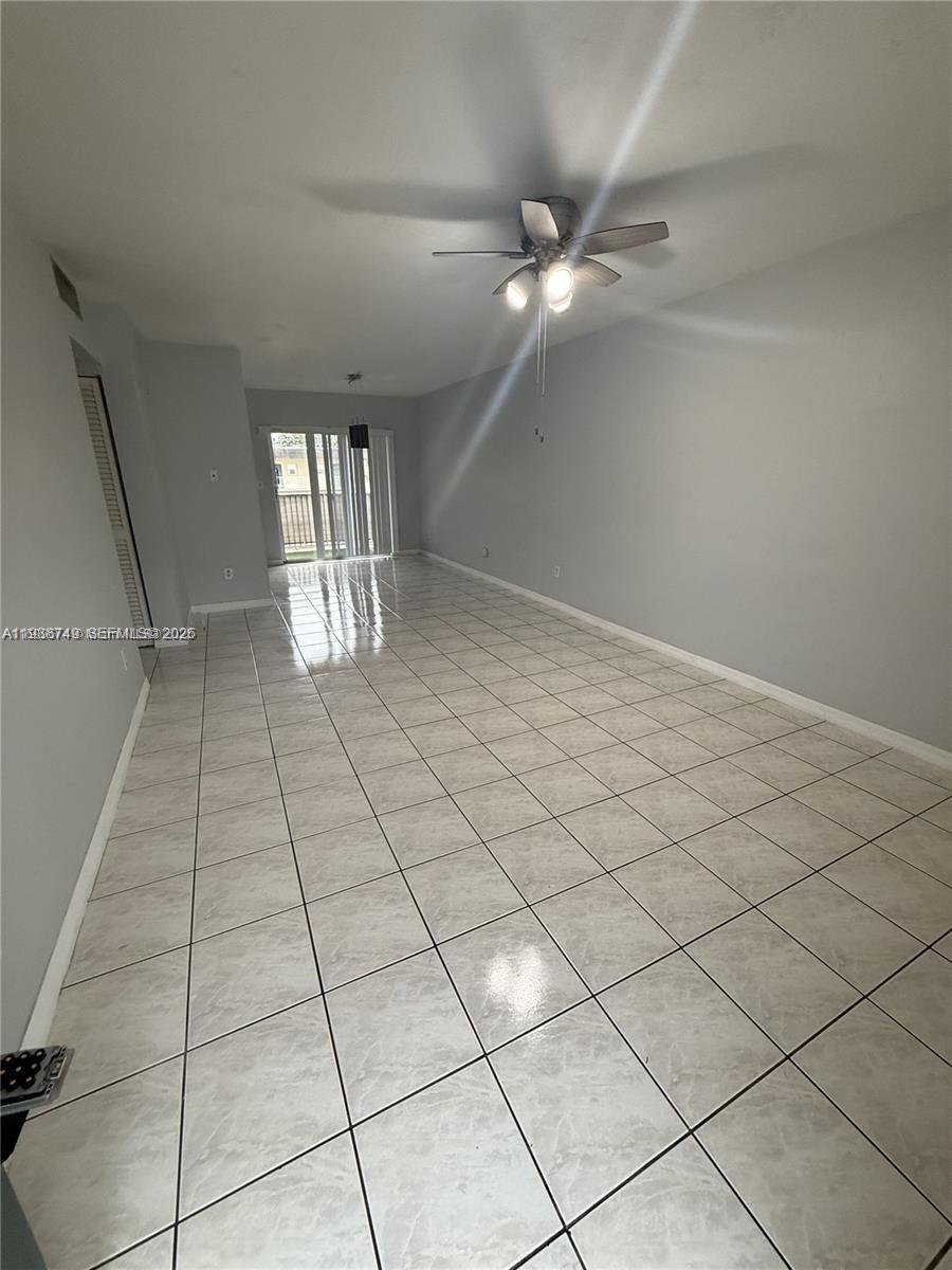 7505 Southwest 82nd Street, Unit 314 Miami, FL 33143 - Photo 2 of 9 a view of an empty room and window