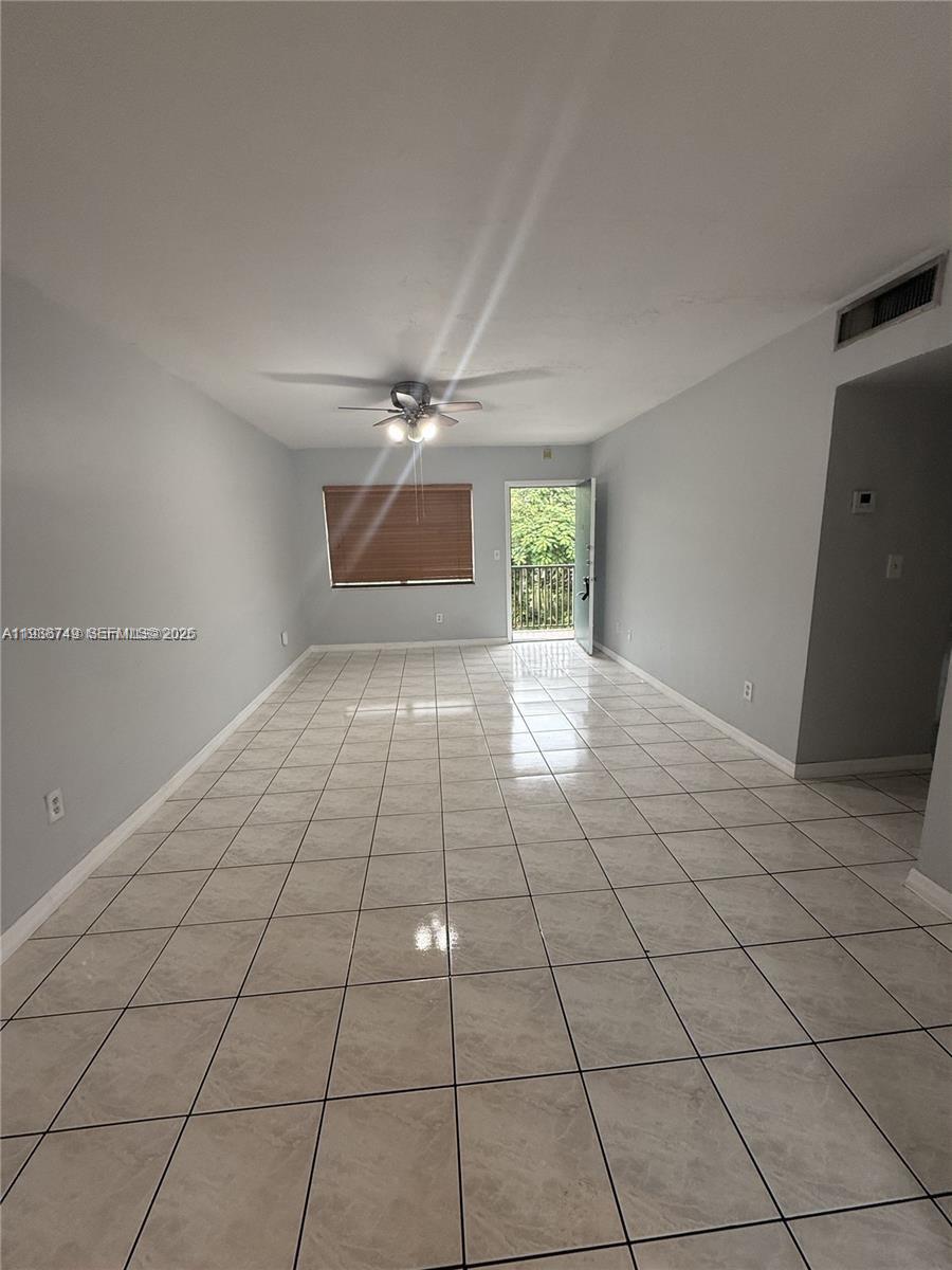 7505 Southwest 82nd Street, Unit 314 Miami, FL 33143 - Photo 3 of 9 a view of an empty room with a window