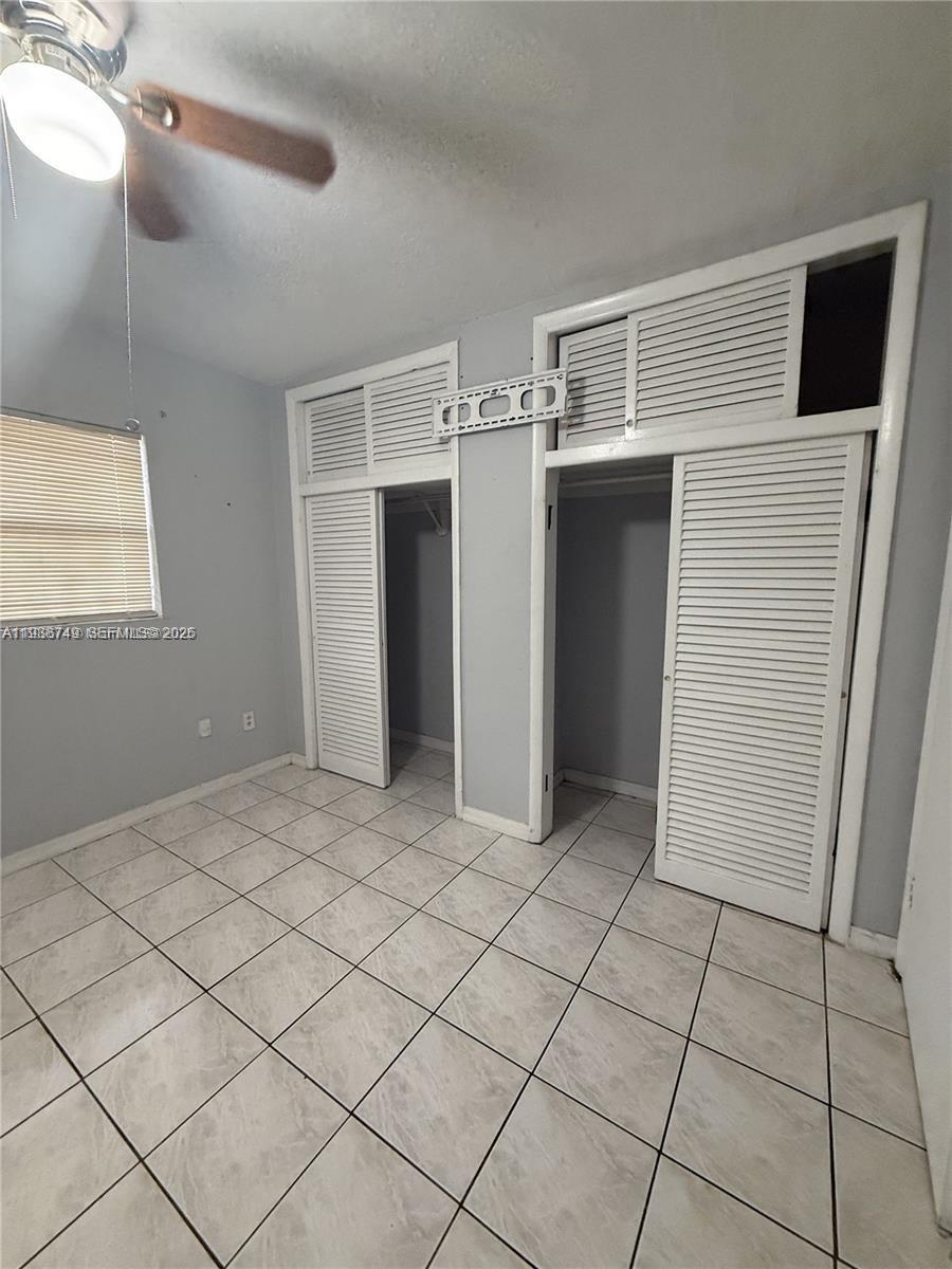 7505 Southwest 82nd Street, Unit 314 Miami, FL 33143 - Photo 7 of 9 a view of a livingroom with wooden cabinets