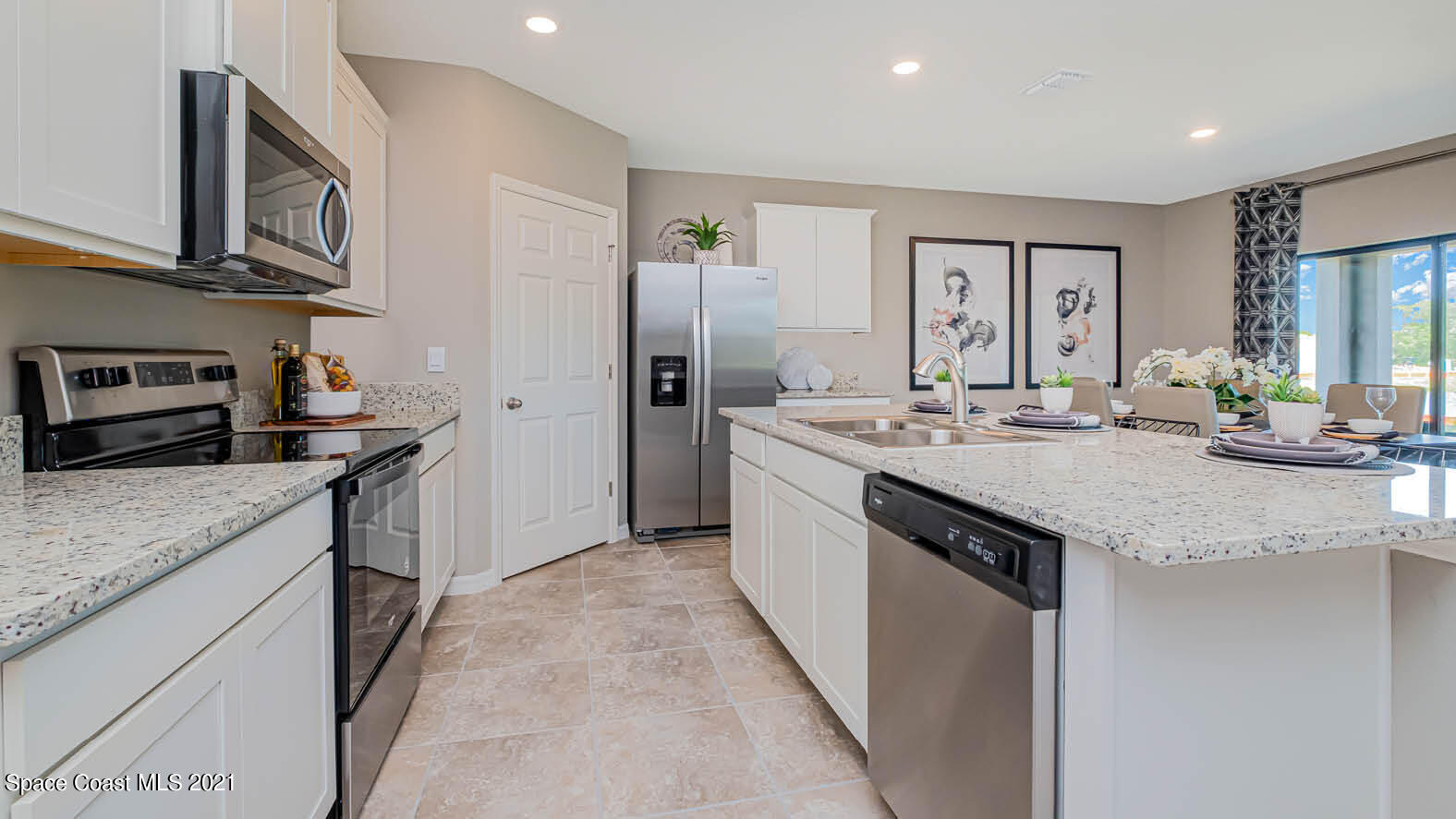 2054 Farmhouse Road Palm Bay, FL 32909 - Photo 3 of 31 a kitchen with stainless steel appliances granite countertop a sink stove and refrigerator