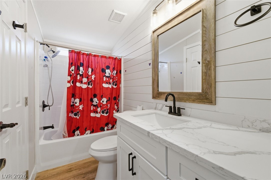 4331 Retread Road Pahrump, NV 89048 - Photo 18 of 31 Modern bath with pristine countertops and warm wood-look flooring.