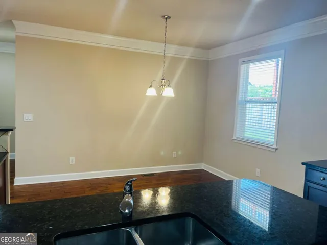 a room with a window and wooden floor