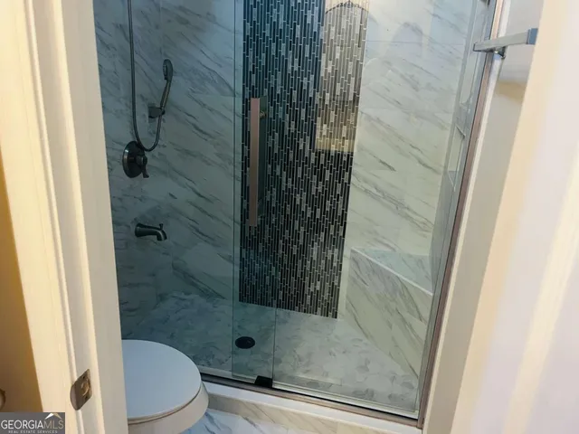 a bathroom with a sink vanity and mirror