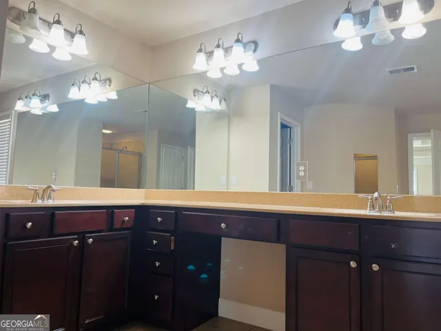 a bathroom with a shower and a tub