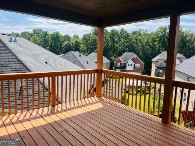 a view of a two chairs on the roof deck