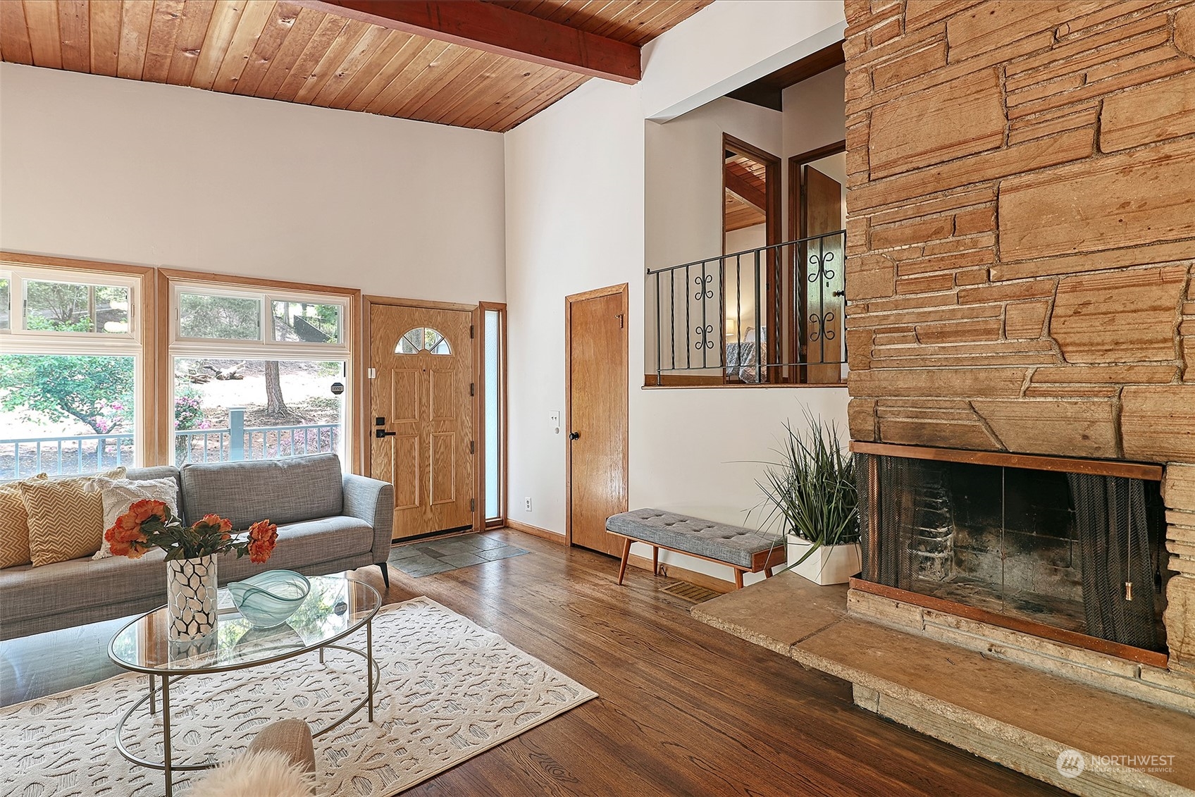 11629 53rd Avenue South Seattle, WA 98178 - Photo 3 of 26 a living room with furniture a fireplace and a floor to ceiling window