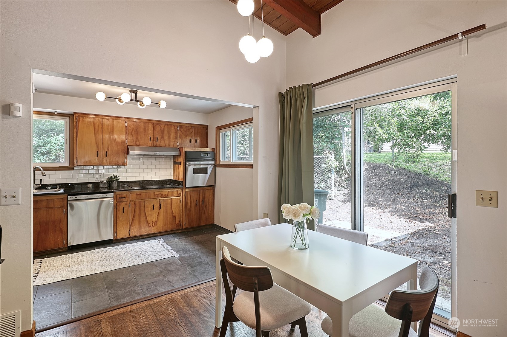 11629 53rd Avenue South Seattle, WA 98178 - Photo 7 of 26 a kitchen with sink cabinets and stainless steel appliances