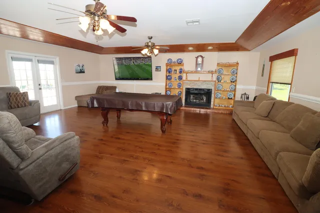 a living room with furniture and a fireplace