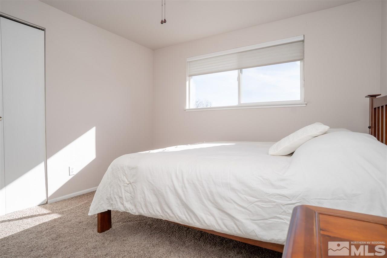 3675 Renee Way Reno, NV 89503 - Photo 19 of 40 a bedroom with a bed and a window