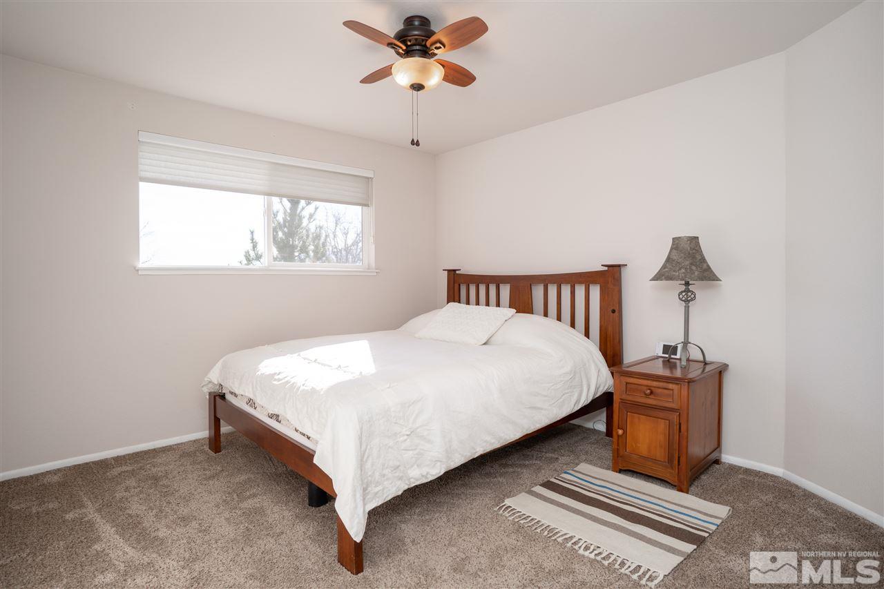3675 Renee Way Reno, NV 89503 - Photo 24 of 40 a bedroom with a bed and window