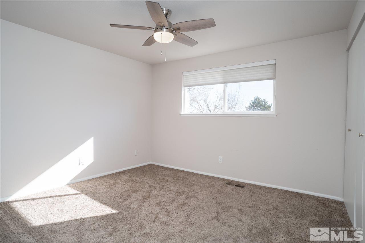 3675 Renee Way Reno, NV 89503 - Photo 25 of 40 an empty room with windows and fan