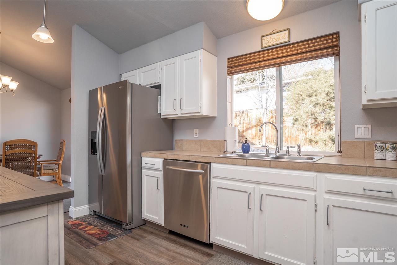 3675 Renee Way Reno, NV 89503 - Photo 4 of 40 a kitchen with appliances cabinets and a window