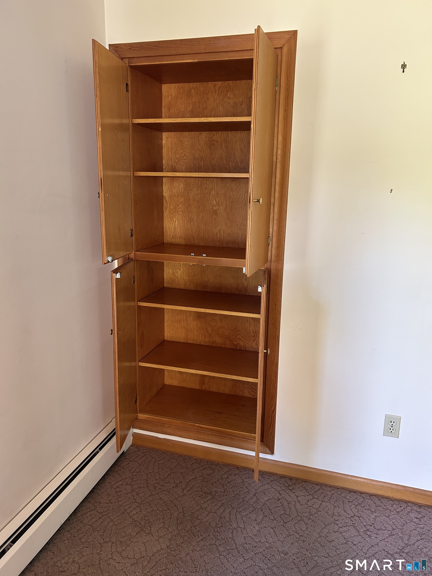 13 Walnut Lane Wallingford, CT 06492 - Photo 16 of 27 a view of an empty room with empty shelves