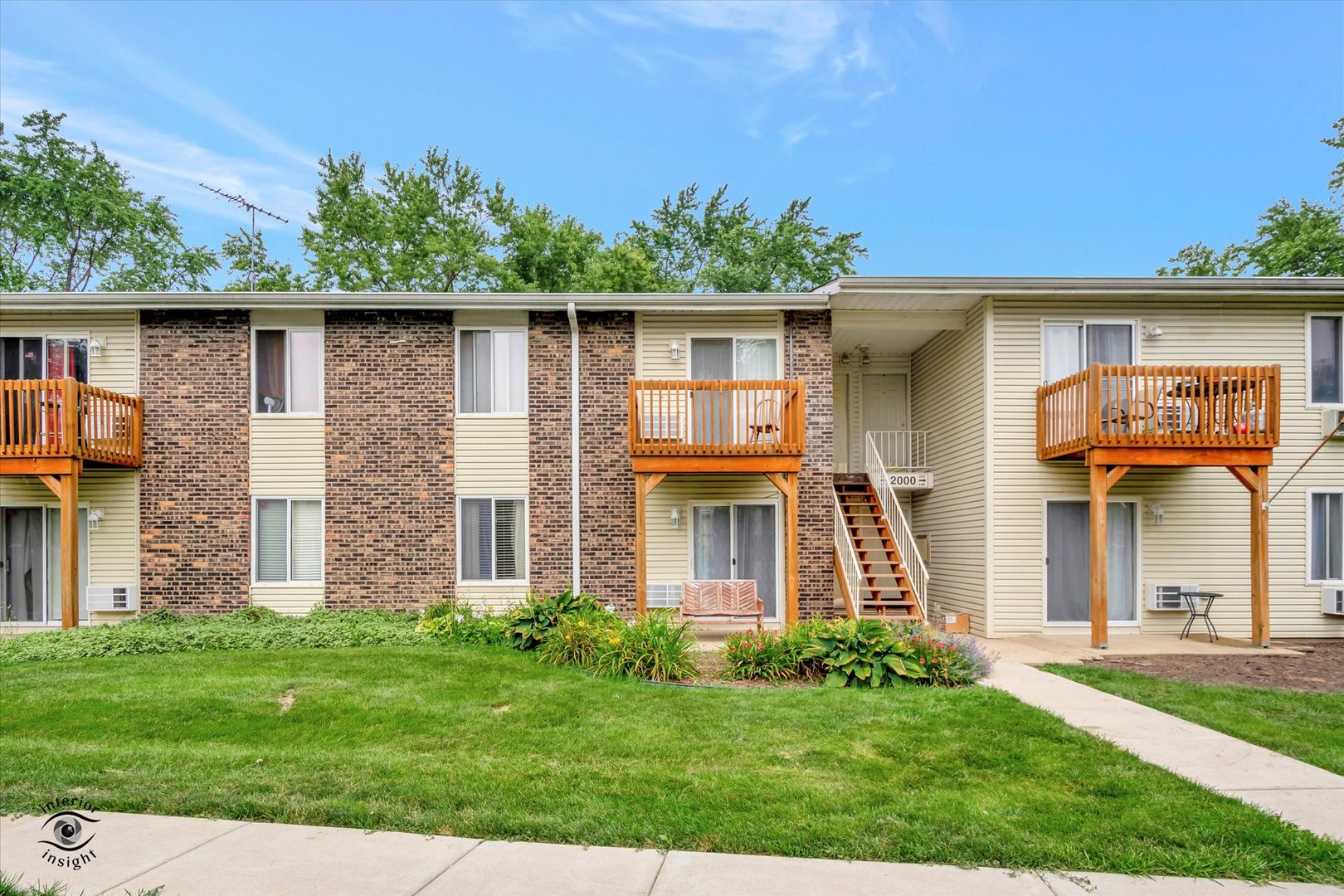 2000 Light Road, Unit 105 Oswego, IL 60543 - Photo 1 of 25 front view of a house with a yard