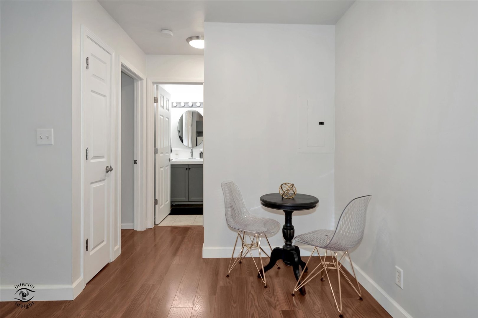2000 Light Road, Unit 105 Oswego, IL 60543 - Photo 9 of 25 a view of a room with wooden floor and bathroom