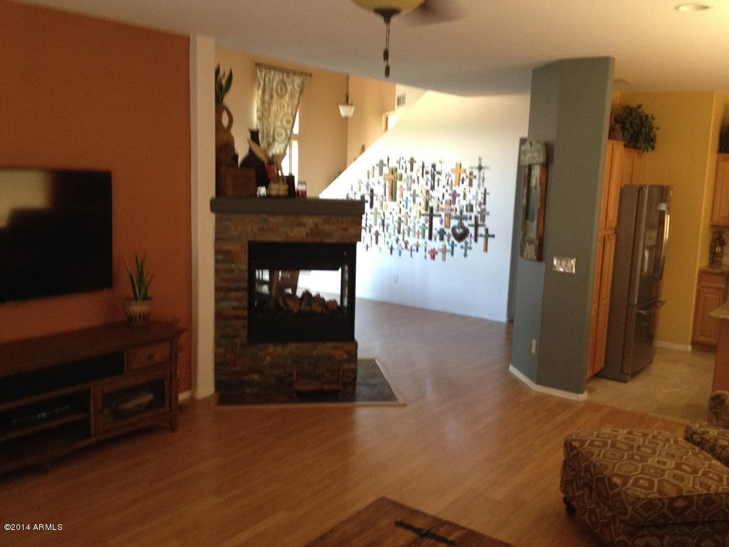 4361 South Rim Court Gilbert, AZ 85297 - Photo 39 of 51 Two-Way Fireplace View from Family Rm