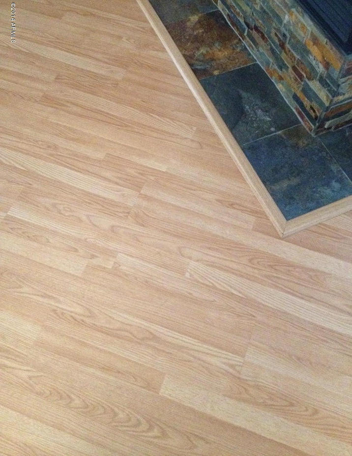 4361 South Rim Court Gilbert, AZ 85297 - Photo 40 of 51 Wood laminate floor - Tile around FP