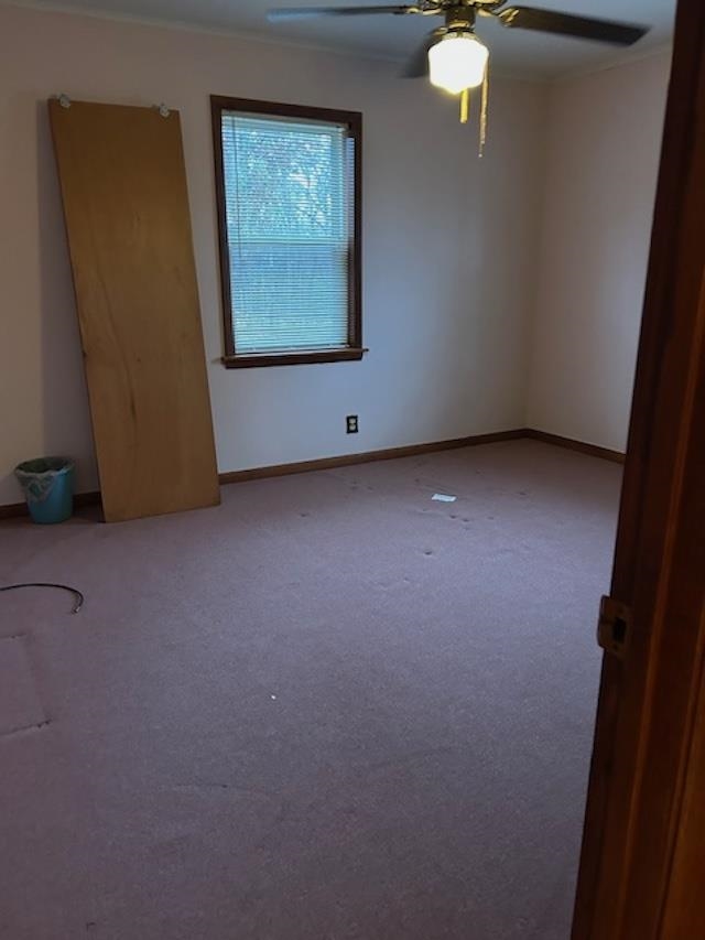 7030 Asbury Glimp Road Ripley, TN 38063 - Photo 17 of 17 Carpeted empty room with baseboards and a ceiling fan