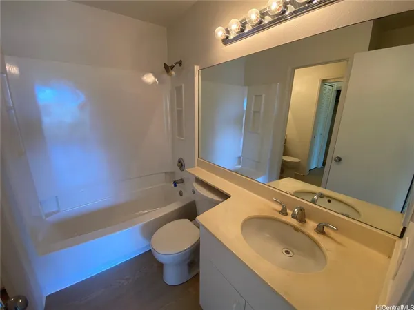 a view of a big room with closet and fan