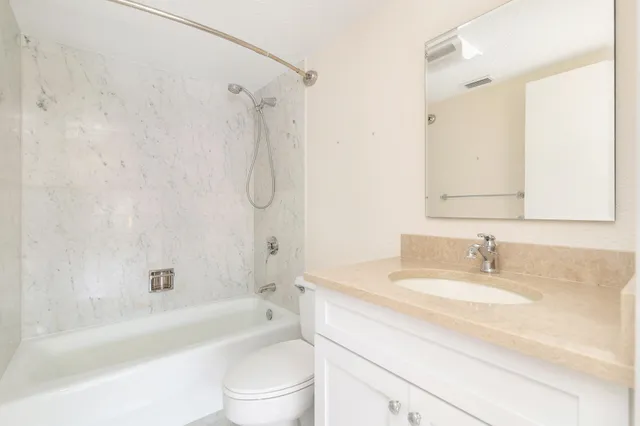 a bathroom with a sink a toilet and a bathtub