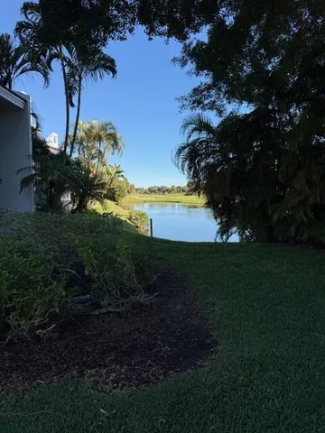 a view of a garden with a lake
