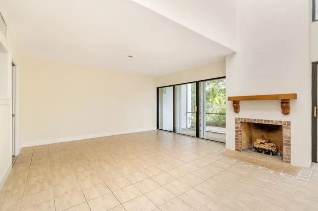 an empty room with fireplace