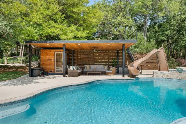a view of a house with a yard porch and sitting area