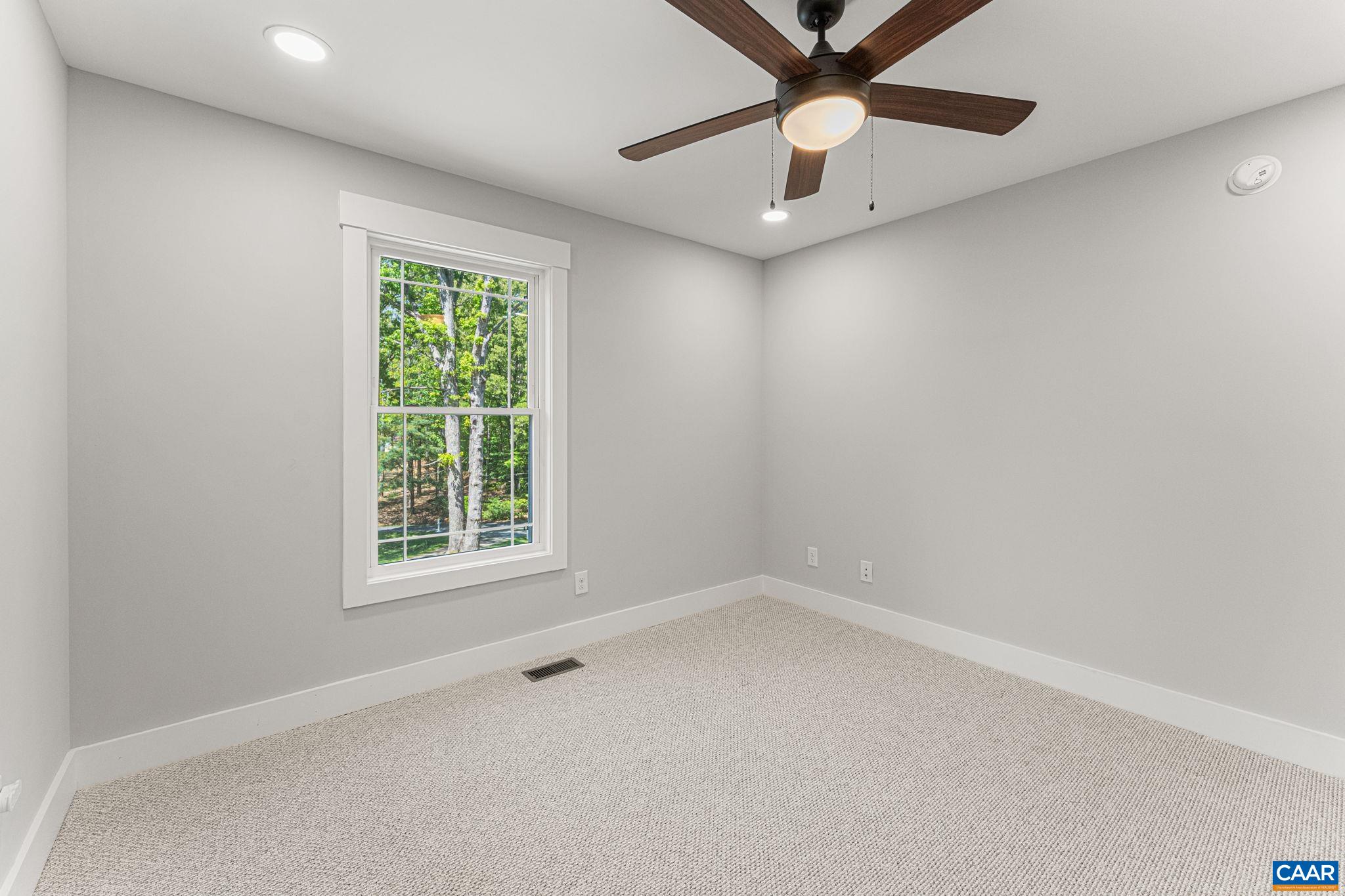 230 Fox Hollow Road Ruckersville, VA 22968 - Photo 34 of 42 an empty room with a window and a fan