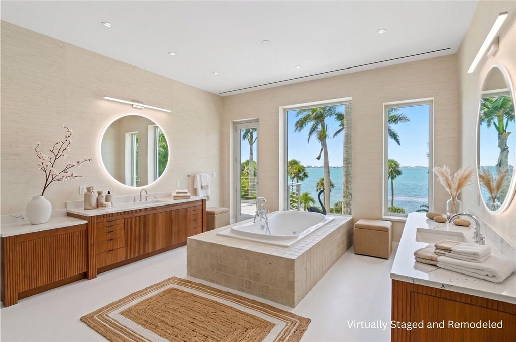 3315 Bay Shore Road Sarasota, FL 34234 - Photo 20 of 96 a living room with furniture a large window and a mirror