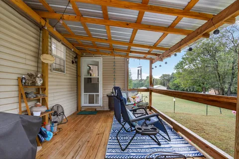 a balcony view with a sitting space