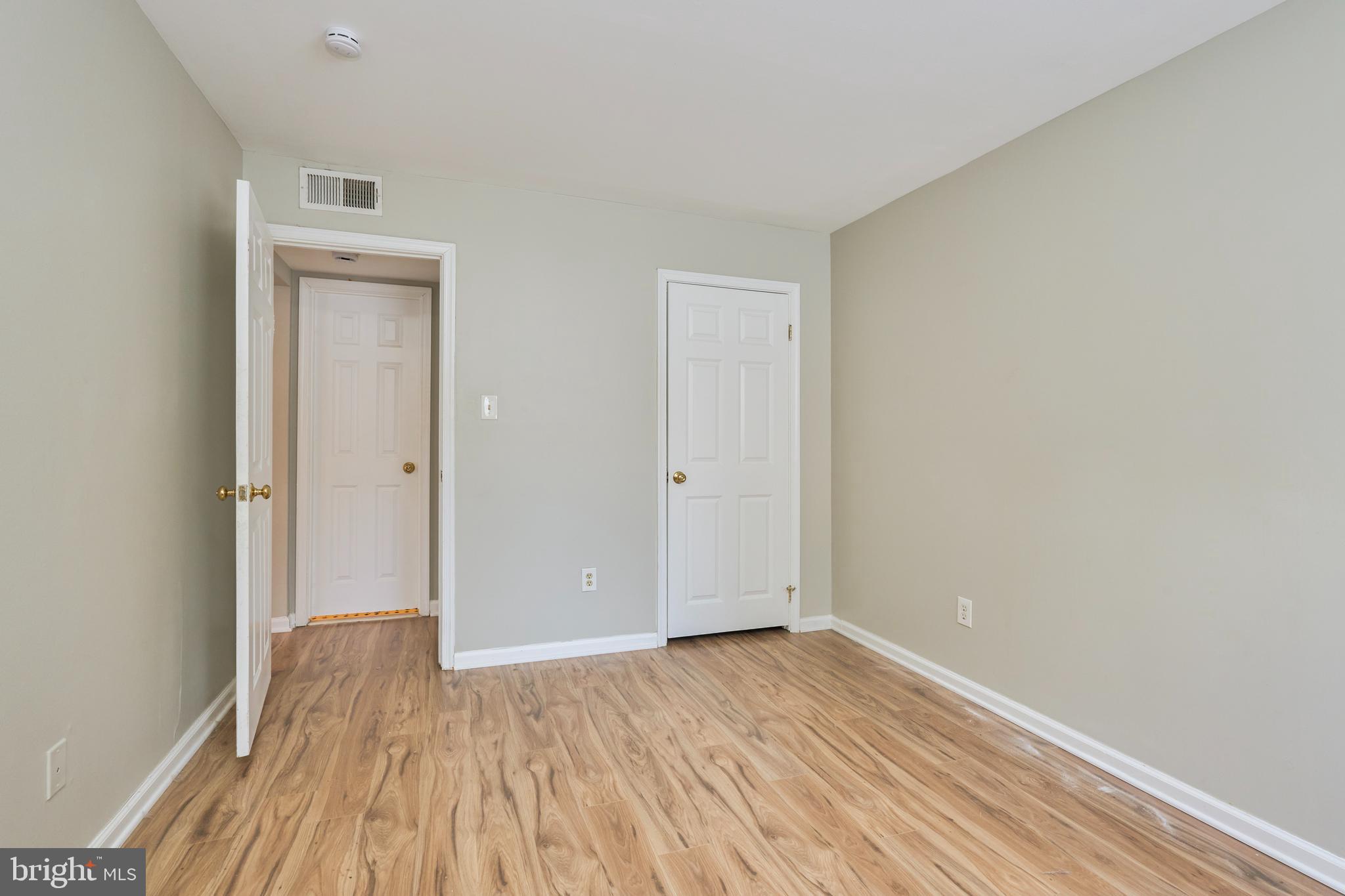 156 Haycock Road, Unit A6 Falls Church, VA 22046 - Photo 20 of 32 a view of a room with wooden floor and a window