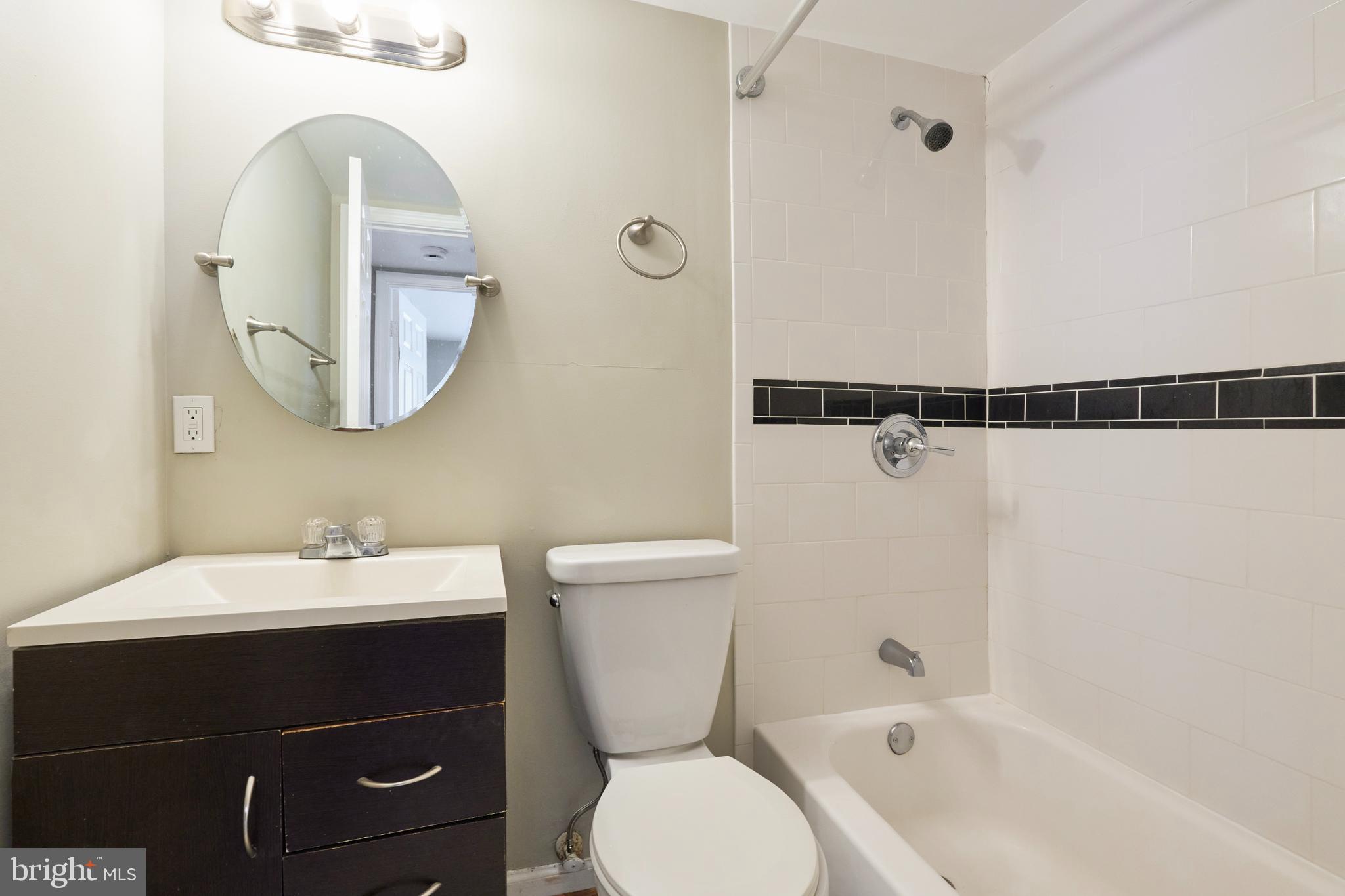 156 Haycock Road, Unit A6 Falls Church, VA 22046 - Photo 22 of 32 a bathroom with a sink mirror toilet and bathtub